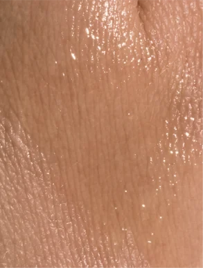 Applying soothing face oil for sensitive skin